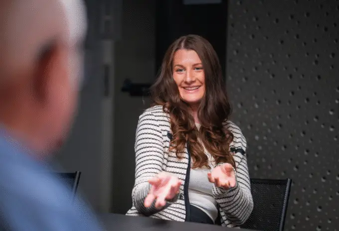 Marin E. Jebsen facilitating team collaboration session with welcoming gesture